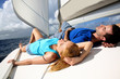 Young couple relaxing on sailboat deck