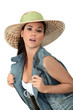 Flirtatious brunette wearing hat