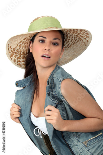 Photo: Flirtatious brunette wearing hat Flirtatious brunette wearing hat