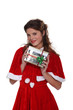 Mrs. Claus holding a Christmas present