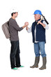 craftsman and apprentice shaking hands