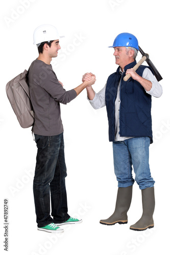 Photo: craftsman and apprentice shaking hands craftsman and apprentice shaking hands