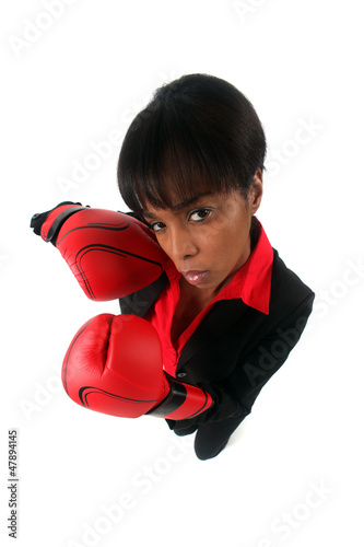 Photo: Angry woman with her punching gloves Angry woman with her punching gloves