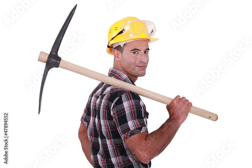 Photo: craftsman holding a pick on his shoulder craftsman holding a pick on his shoulder