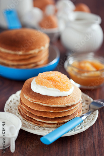 Photo: Buttermilk oat bran pancakes with pike caviar, selective focus Buttermilk oat bran pancakes with pike caviar, selective focus