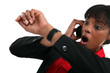 businesswoman consulting her watch open-mouthed