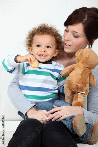 Photo: mother holding her little boy mother holding her little boy