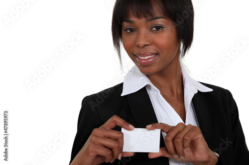 Photo: black businesswoman showing visit card black businesswoman showing visit card