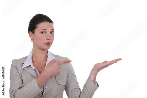 Photo: A businesswoman showing the way. A businesswoman showing the way.