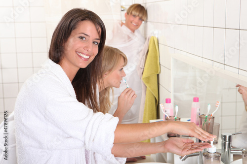 Photo: Young women getting ready for their day Young women getting ready for their day