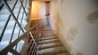 Driving downwards on stairs of under construction house to