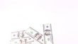 Hundred dollar banknotes appear and disappear as fan