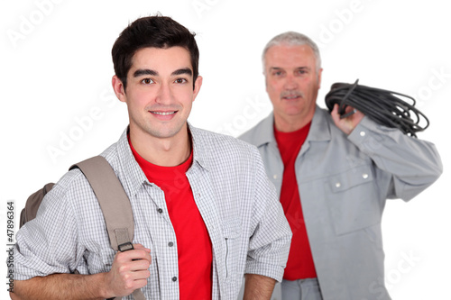 Photo: Apprentice standing near his boss Apprentice standing near his boss