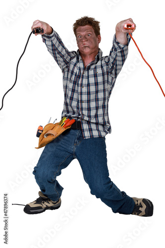 Photo: Man receiving electric shock Man receiving electric shock