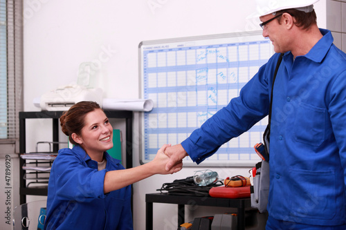 Photo: A couple of construction worker in a office. A couple of construction worker in a office.