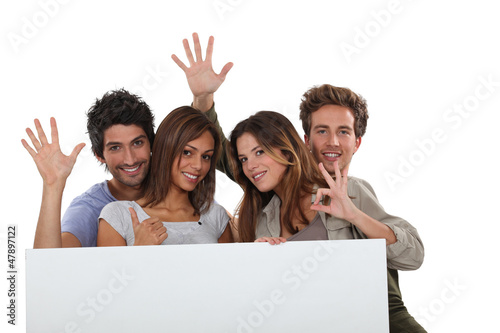 Photo: four young positive people four young positive people
