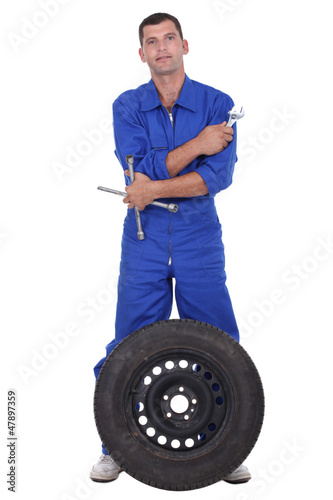 Photo: Mechanic with wheel Mechanic with wheel