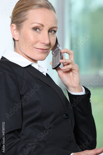 Photo: Businesswoman on the phone. Businesswoman on the phone.