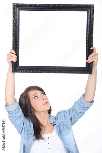 Photo: woman holding a mirror woman holding a mirror