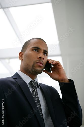 Photo: African businessman calling his boss African businessman calling his boss