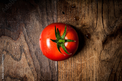 Photo: tomato on wood tomato on wood