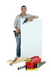 Handyman with tools and message board