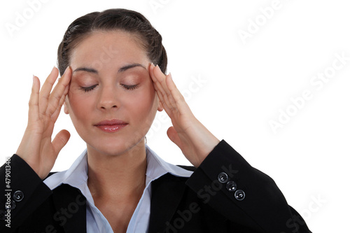 Photo: Businesswoman with tension headache Businesswoman with tension headache