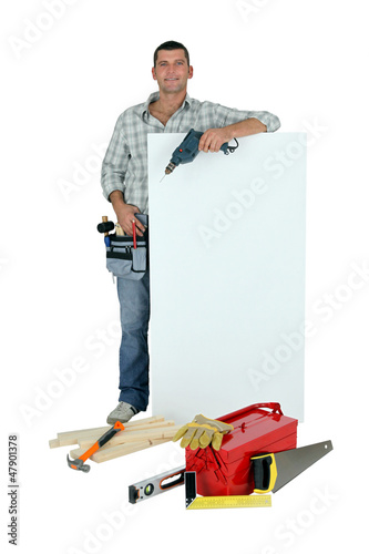 Photo: Handyman with tools and message board Handyman with tools and message board