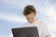 Guy with notebook against sky background