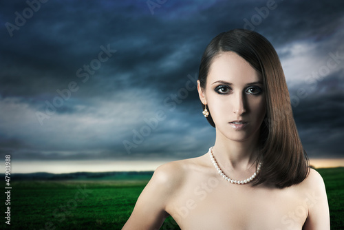 Photo: Portrait of Sexy Woman on Dark Background Portrait of Sexy Woman on Dark Background