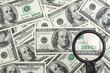 Look through a magnifying glass on the money