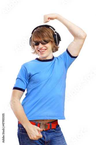 Photo: Happy smiling young man dancing Happy smiling young man dancing