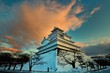 夕日に輝く積雲と天守閣