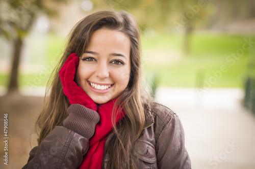 Photo: Pretty Woman Portrait Wearing Red Scarf and Mittens Outside Pretty Woman Portrait Wearing Red Scarf and Mittens Outside