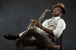 Black american jazz saxophone player. Vintage. Studio shot.