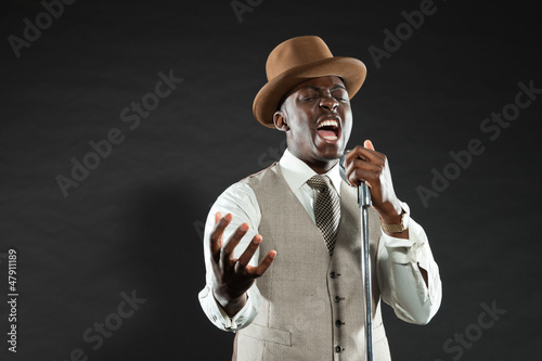 Photo: Black american jazz singer. Vintage. Studio shot. Black american jazz singer. Vintage. Studio shot.