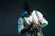 Black american jazz trumpet player. Vintage. Studio shot.
