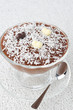 chocolate mousse in a glass sundae dish with chocolate hearts
