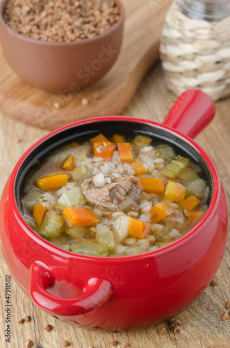 Photo: soup with beef and buckwheat in a red pot soup with beef and buckwheat in a red pot
