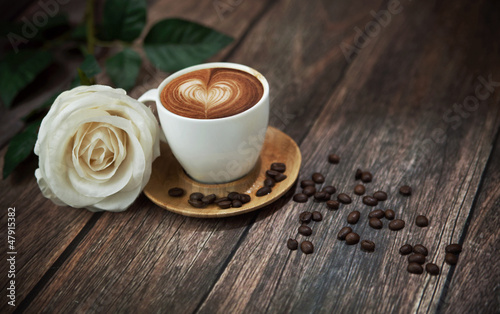 Photo: Hot coffee and beautiful white rose Hot coffee and beautiful white rose