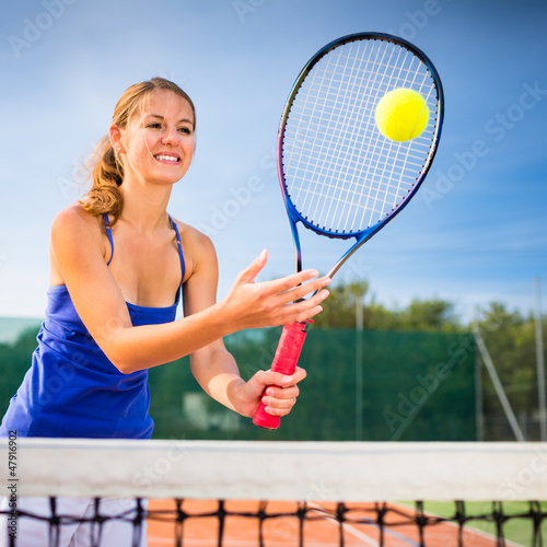 Photo: Portrait of a pretty young tennis player Portrait of a pretty young tennis player