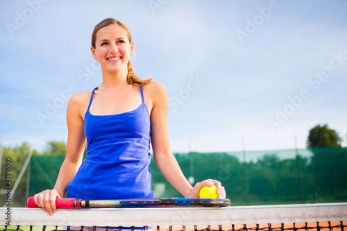 Photo: Portrait of a pretty young tennis player with copyspace Portrait of a pretty young tennis player with copyspace