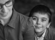Black-white photo of mother and her happy son