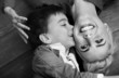 Pretty shoot of cute boy kissing mother