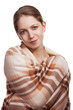 Beautiful young woman hid wool blanket