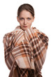 Beautiful young woman wrapped in a plaid