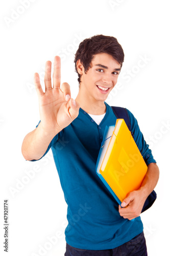 Photo: Young happy student showing Ok sign Young happy student showing Ok sign