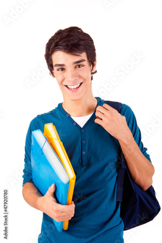 Photo: Young happy student carrying books Young happy student carrying books