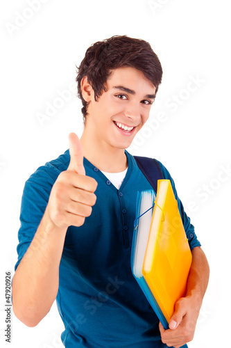 Photo: Young happy student showing thumbs up Young happy student showing thumbs up