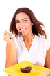 Young woman eating chocolate cake